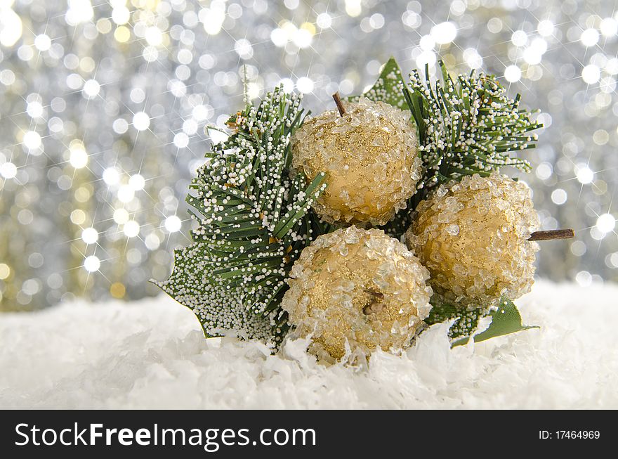 Golden Christmas decorations against a sparkling background