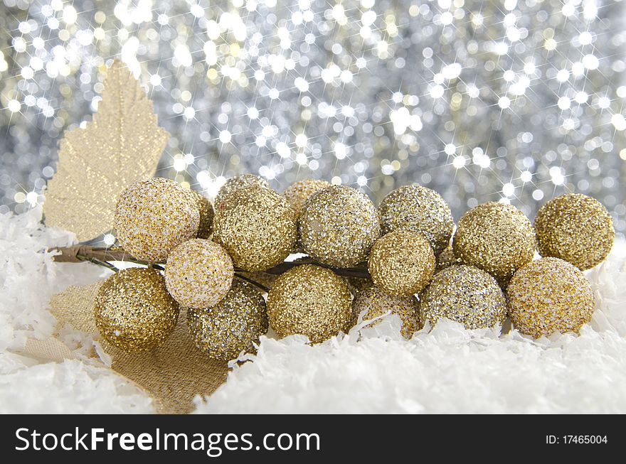 Golden Christmas decorations against a sparkling background