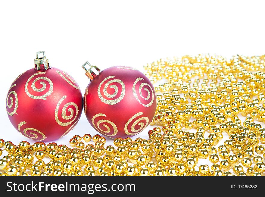 Two red christmas ball and gold decoration, isolat