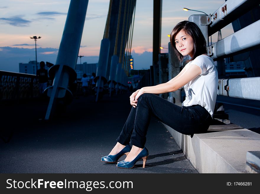 Fashion photos on the bridge in the evening. Fashion photos on the bridge in the evening.