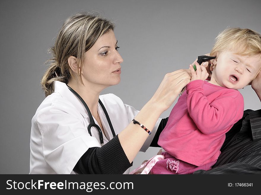 Young physician practicing medicine for children. Young physician practicing medicine for children