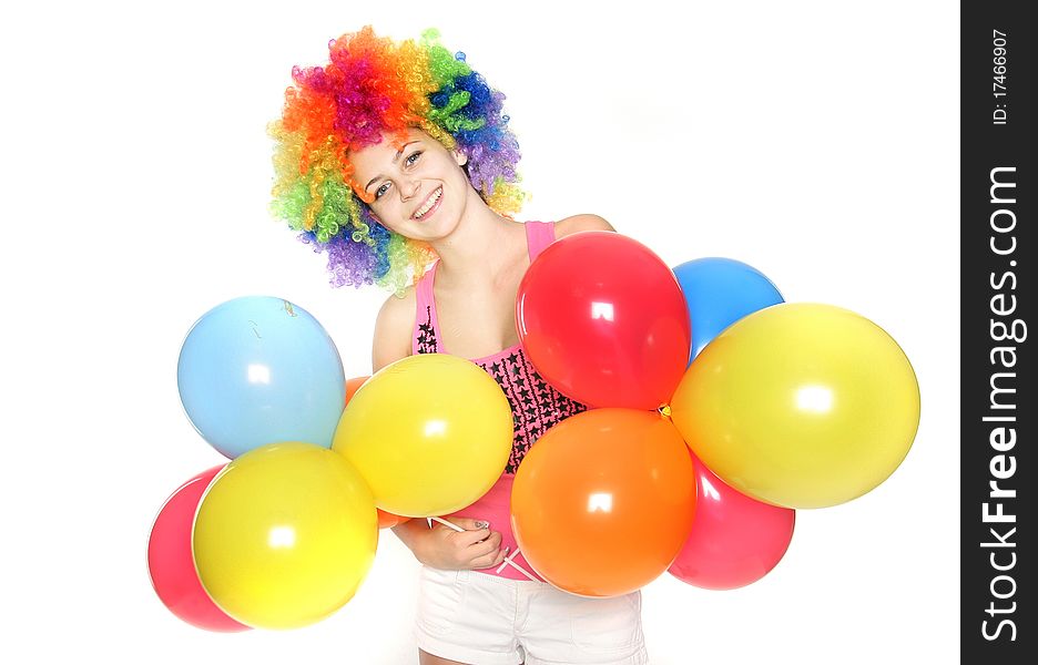 Bright studio portrait of happy young woman with balloons