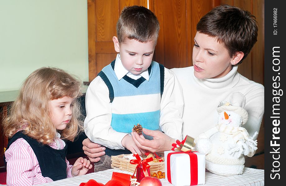 Happy Family preparing Christmas ornaments. Happy Family preparing Christmas ornaments