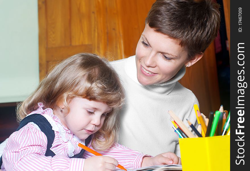 Happy mother and the daughter mould from plasticine