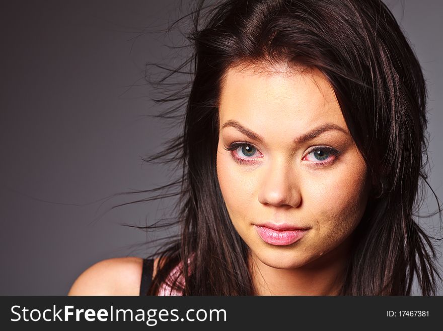 Girl Looks Pensively Into The Camera