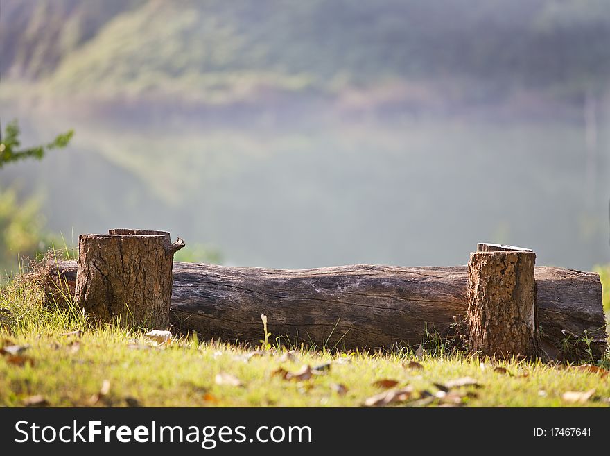 Log Bench On mountain in front of the river