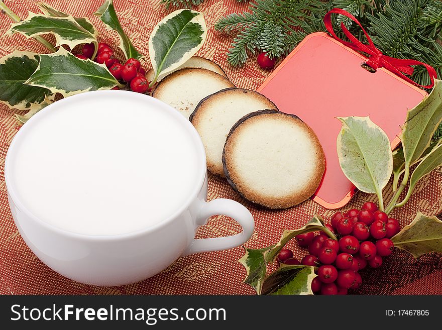 Greeting card with a small cookie for Santa Claus.