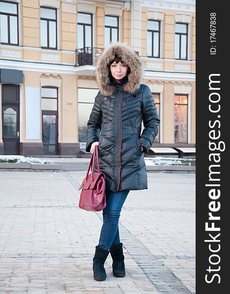 Girl in winter jacket on the street. Girl in winter jacket on the street