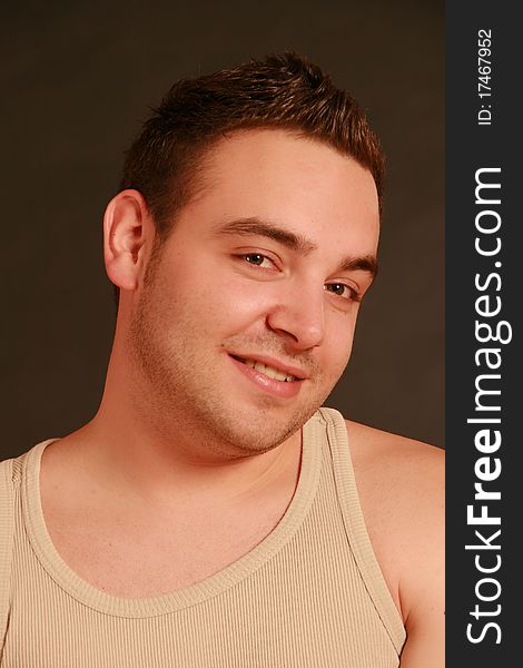 Portrait of a young man, Studio. Part of a grimace series, same model, different emotions.