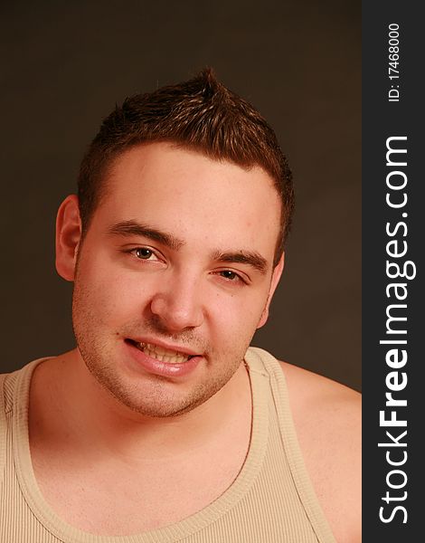 Portrait of a young man, Studio. Part of a grimace series, same model, different emotions.