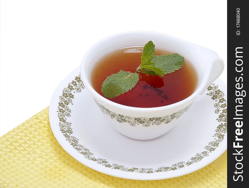 Black Tea with mint on the yellow napkin