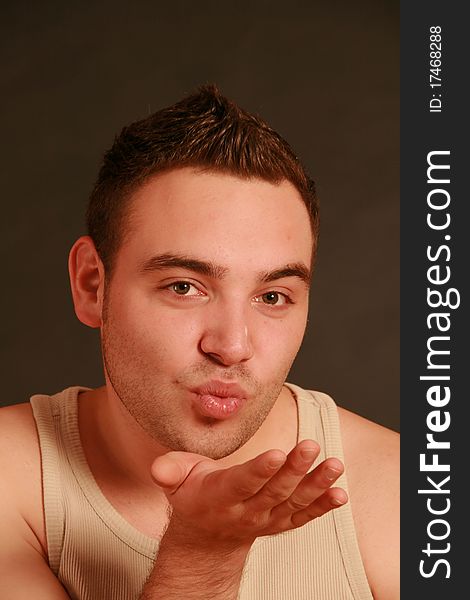 Portrait of a young man, Studio. 
Part of a grimace series, same model, different emotions.