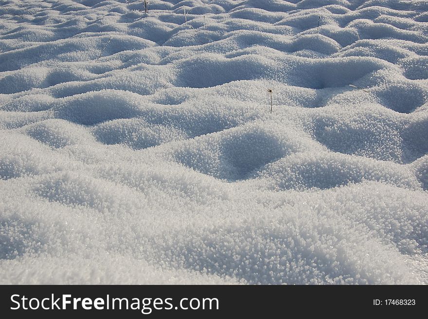 White frozen crystal textured snow. White frozen crystal textured snow