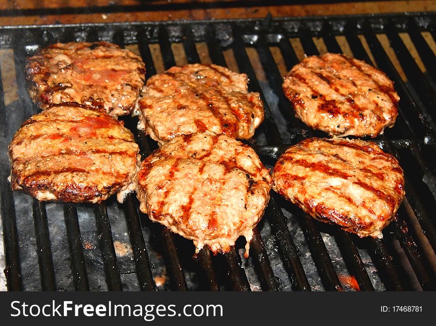 Hamburger patties on hot grill. Hamburger patties on hot grill