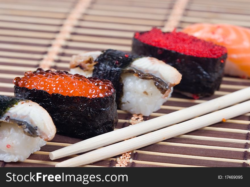 Traditional japanese sushi and rolls close up. Traditional japanese sushi and rolls close up