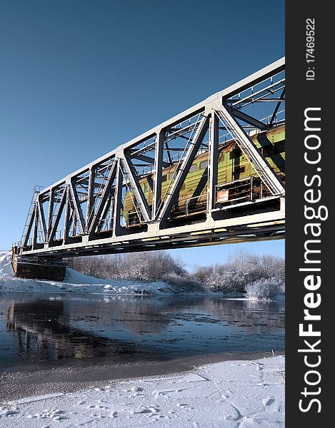 Railway bridge through small river