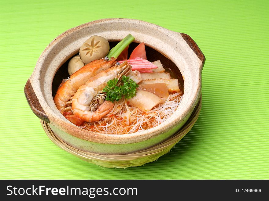 Claypot seafood Tom-Yam soup with rice noodle. Claypot seafood Tom-Yam soup with rice noodle