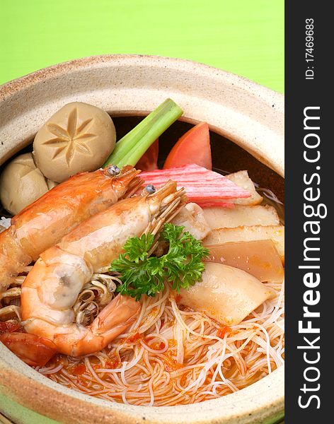 Claypot seafood Tom-Yam soup with rice noodle. Claypot seafood Tom-Yam soup with rice noodle