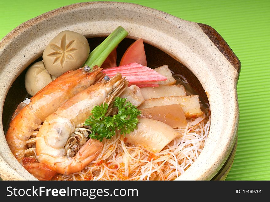 Claypot seafood Tom-Yam soup with rice noodle. Claypot seafood Tom-Yam soup with rice noodle
