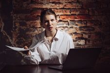 Confused Busy Woman Working With Laptop And Documents Royalty Free Stock Images