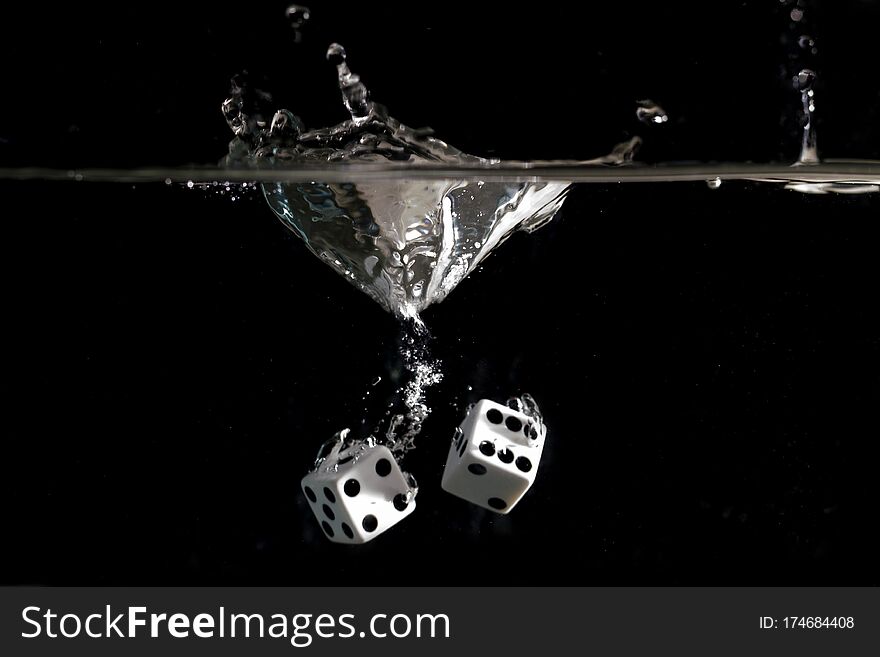 Dice splashing into a tank of water. Dice splashing into a tank of water