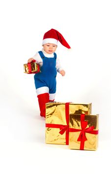 Little Boy In Santa Hat With A Bunch Of Gifts Royalty Free Stock Image Little Boy In Santa Hat With A Bunch Of Gifts Royalty Free Stock Image