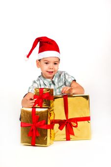 Little Boy In Santa Hat With A Bunch Of Gifts Royalty Free Stock Images Little Boy In Santa Hat With A Bunch Of Gifts Royalty Free Stock Images