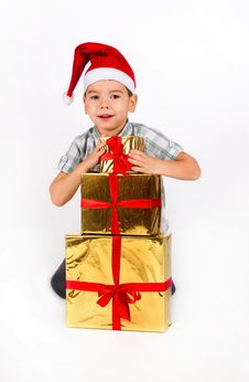 Little Boy In Santa Hat With A Bunch Of Gifts Royalty Free Stock Images Little Boy In Santa Hat With A Bunch Of Gifts Royalty Free Stock Images
