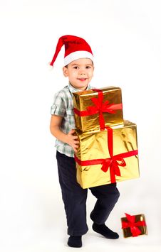 Little Boy In Santa Hat With A Bunch Of Gifts Stock Image Little Boy In Santa Hat With A Bunch Of Gifts Stock Image