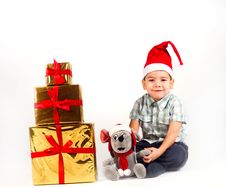 Little Boy In Santa Hat With A Bunch Of Gifts Royalty Free Stock Image Little Boy In Santa Hat With A Bunch Of Gifts Royalty Free Stock Image