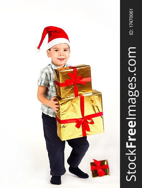 Little Boy In Santa Hat With A Bunch Of Gifts