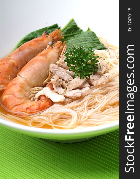 Chinese style seafood noodles in a white bowl