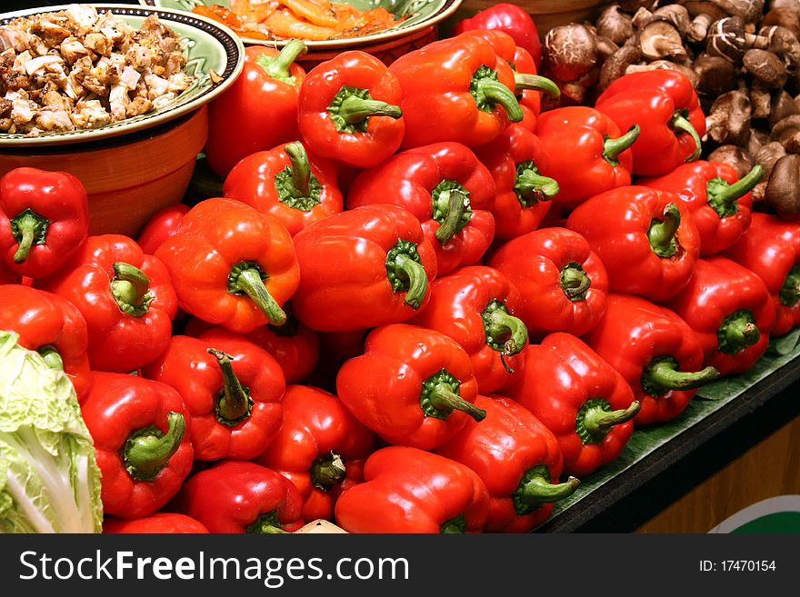 Rows of Red Capsicums on Display at a Marketplace