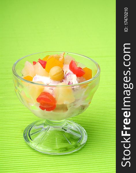An ice cream with fruit on top