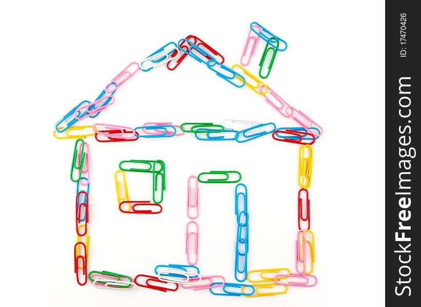 Multi-coloured house from paper clips on a white background
