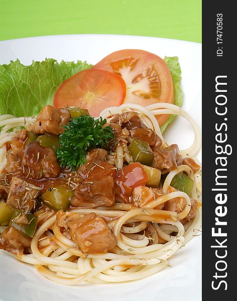 A plate of pasta with onion and spice gravy