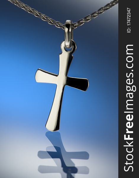 Cross medalion with neclace, blue background. Cross medalion with neclace, blue background