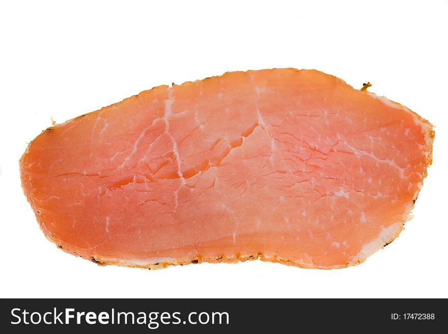 The cut off piece of smoked meat on a white background. The cut off piece of smoked meat on a white background