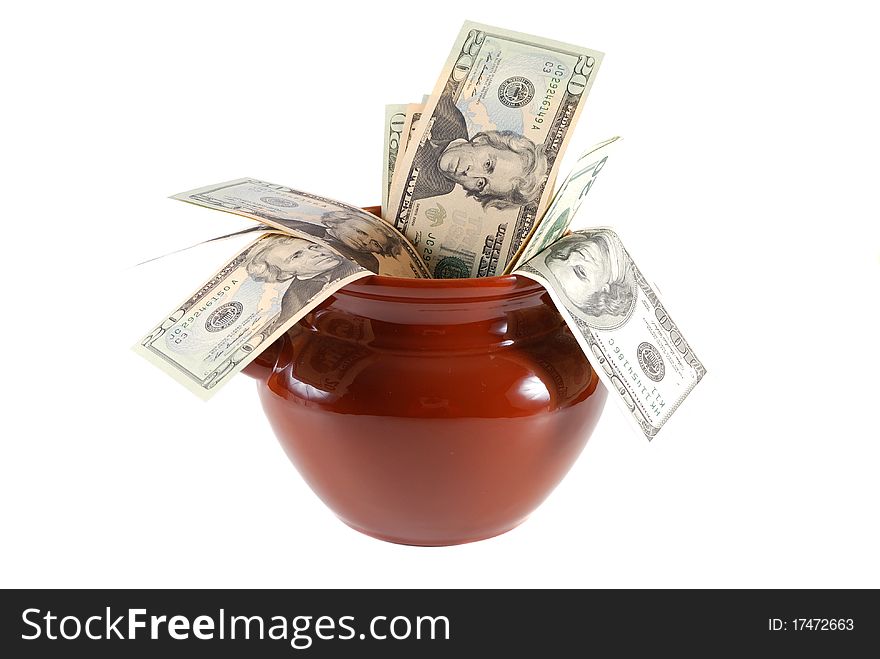 Money in a clay pot on a white background. Money in a clay pot on a white background