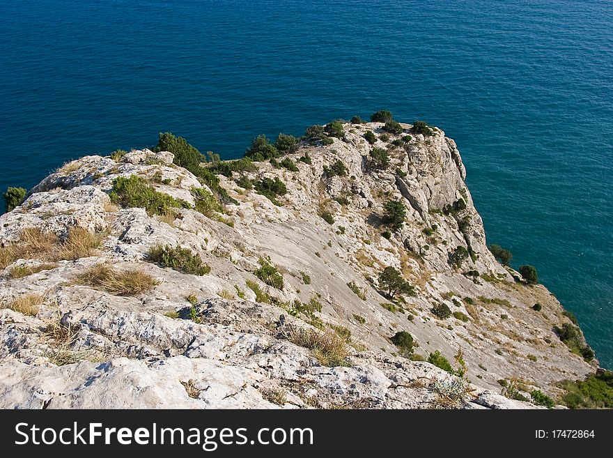 Limestone rock above the sea in Sudak, Crimean peninsula.