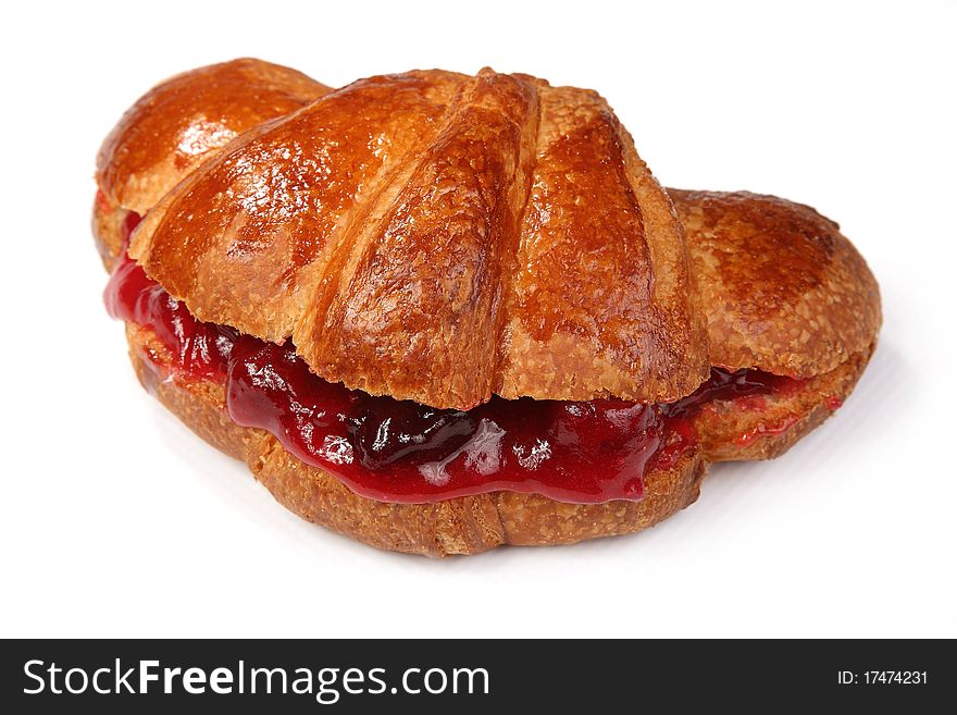 Appetizing croissant with strawberry jam on a white background