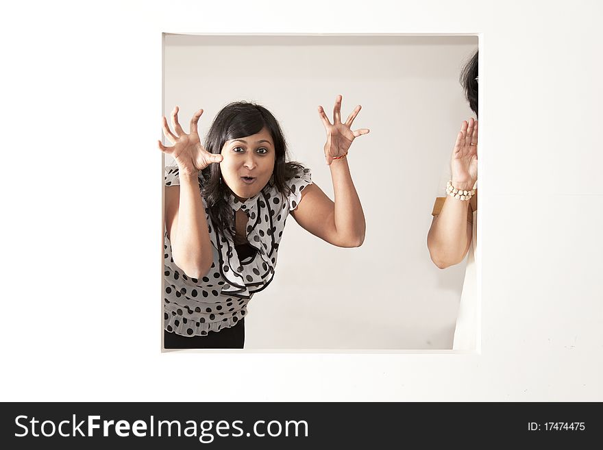 Scary Indian lady with polka top on a light background. Scary Indian lady with polka top on a light background