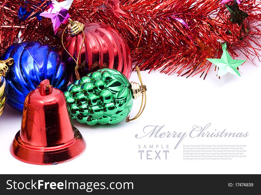 Red and blue christmas blubs and red bell on white background with copy space. Red and blue christmas blubs and red bell on white background with copy space