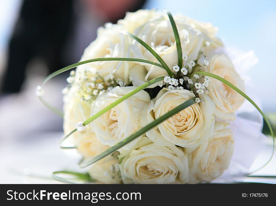 Beautiful bouquet of the bride executed from light beige roses