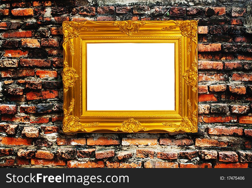 Golden frame on very old brick wall. Golden frame on very old brick wall