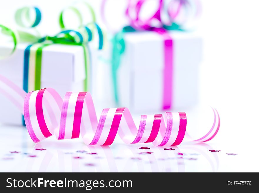 A background of white presents with colorful ribbons and bows. A background of white presents with colorful ribbons and bows.