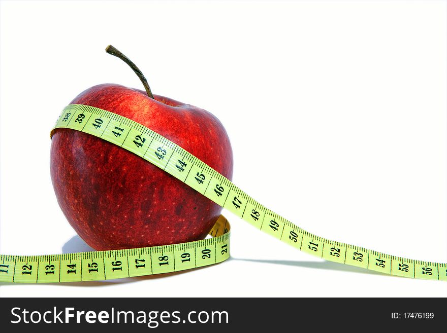 Apple with a measuring tape around. Apple with a measuring tape around