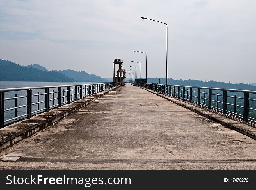 Road on dam in country, Thailand.