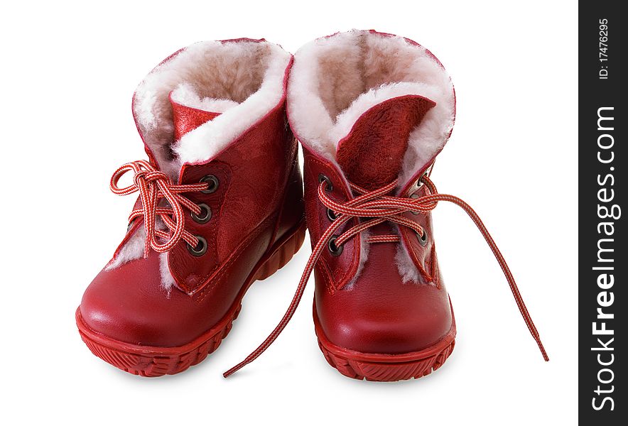 Two red children's boots on a white background. Two red children's boots on a white background