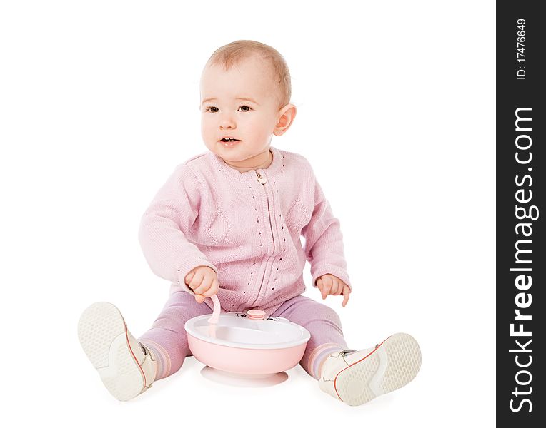 Happy baby with plate and spoon